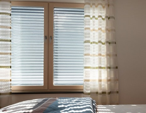 Automated curtains in a bedroom