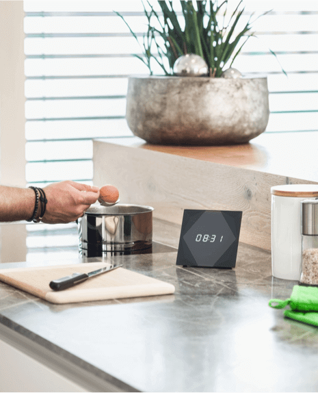 Man preparing a meal with Touch & Grill on the countertop