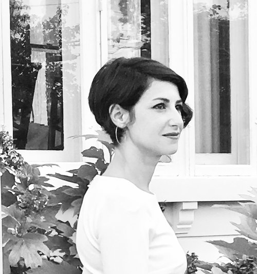 Profile photo of Rachel Calemmo in front of window and plants.