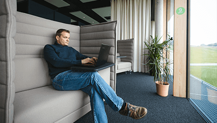 Loxone employee working in private seating area