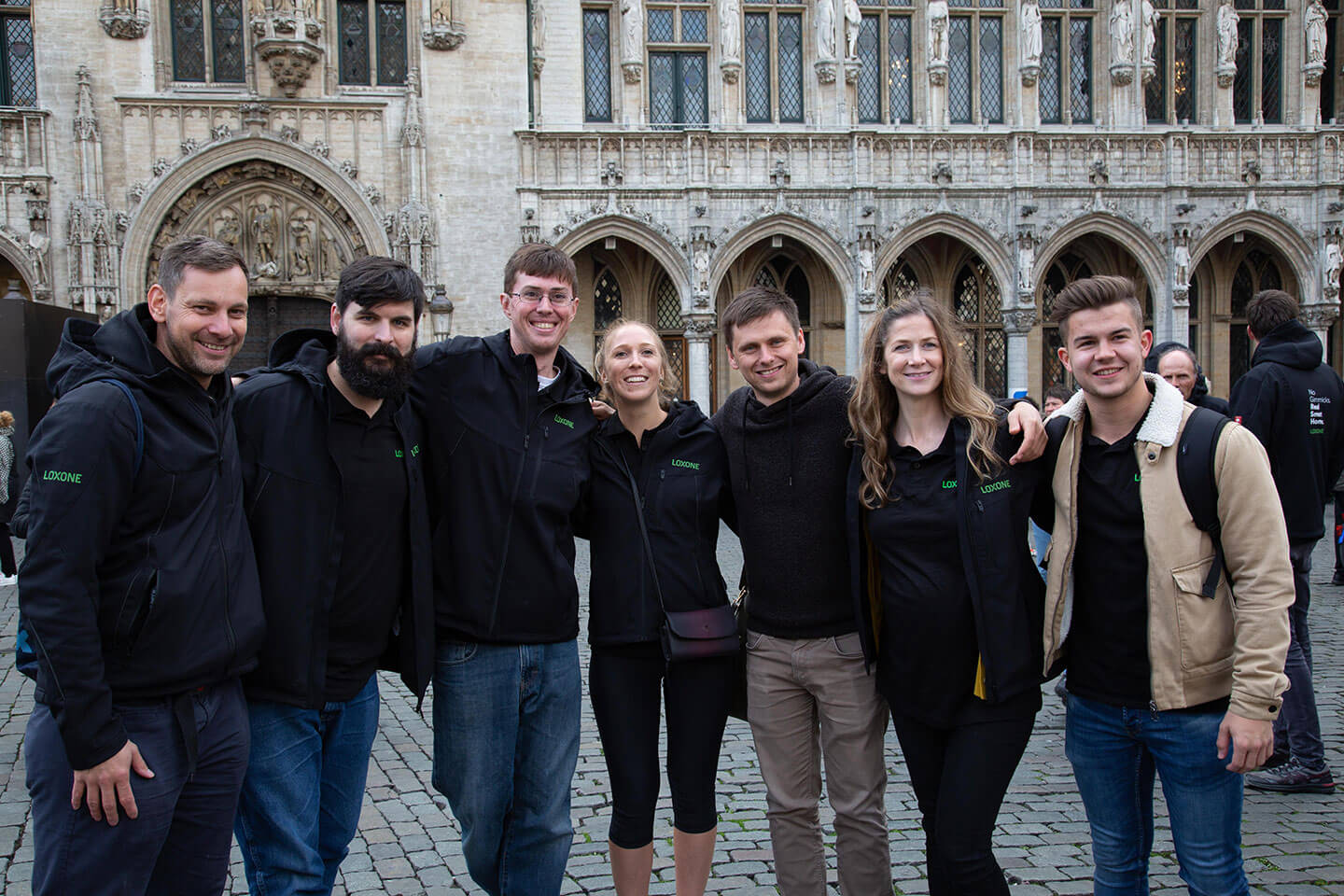 Loxone employees standing together at Grand Place