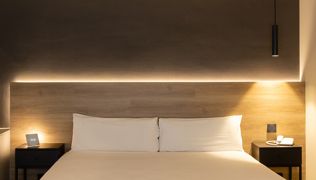 hotel room bed with lighting