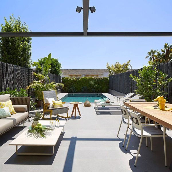 Outdoor living area with lights and garden.