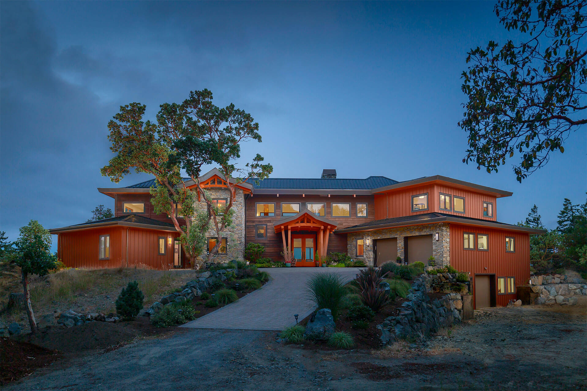 Exterior of large Olympic Panorma home with trees.