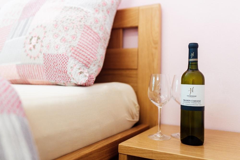 Bottle of wine on the bedside table