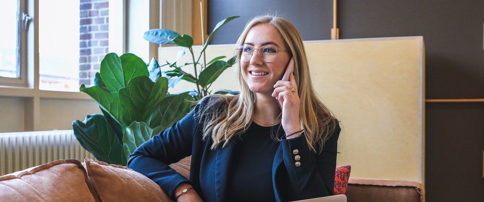 A woman talks with phone